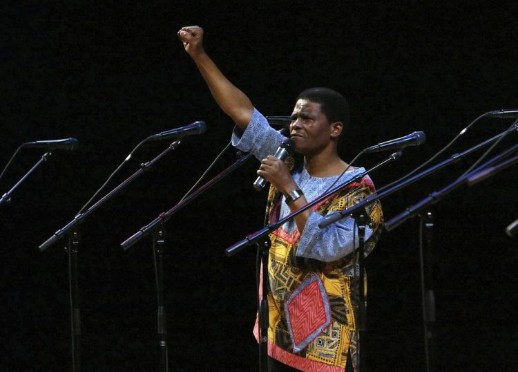 Ladysmith Black Mambazo founding member Joseph Shabalala gestures to the audience during the group's performance at the Kimmel Center in Philadelphia in 2008. 