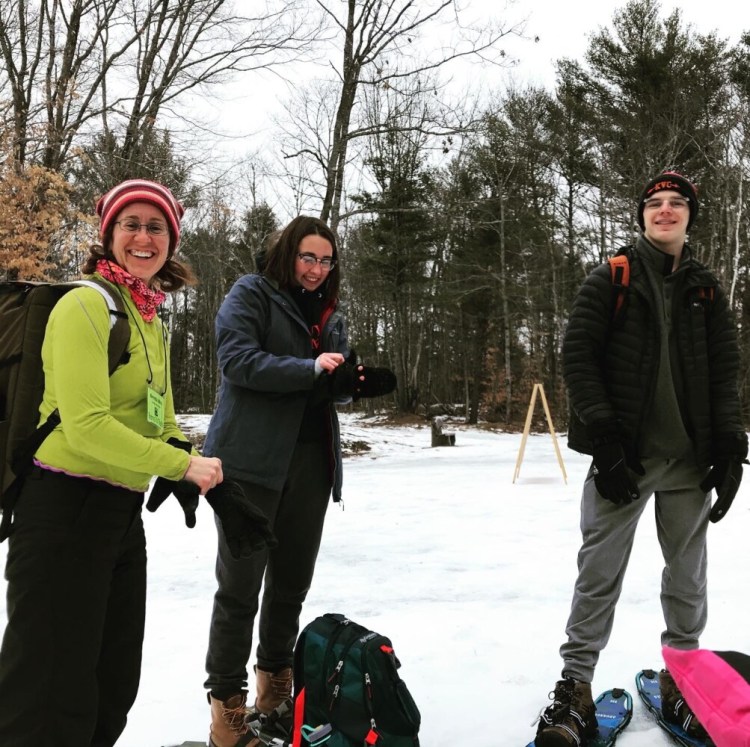 From left, Advisor Brenda Weiss and Cony High School students Sarah Cook-Wheeler and Jack Begin on snowshoes at Teens to Trails 2020 Winter Skills Weekend in Jefferson.