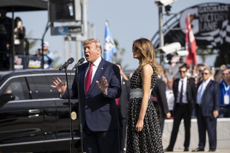 President Trump, accompanied by first lady Melania Trump, gives the instructions "gentlemen, start your engines," before the start of the NASCAR Daytona 500 auto race Sunday at Daytona International Speedway in Daytona Beach, Fla.