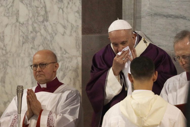 Pope Francis wipes his nose during the Ash Wednesday Mass opening Lent inside the Basilica of Santa Sabina in Rome. 

