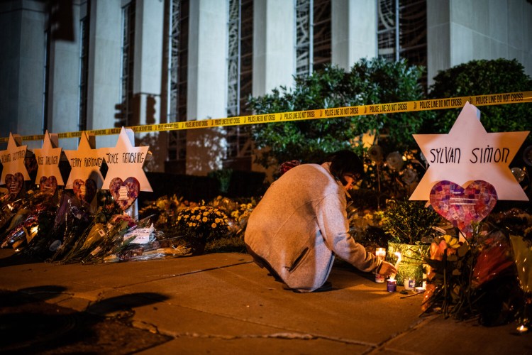 A woman leaves a candle in front of the Tree of Life Synagogue in Pittsburgh after a deadly attack there in 2018. In 2017, anti-Semitic incidents in the United States increased 57 percent, according to the Anti-Defamation League, the largest single-year increase the group has seen and the second-highest total in its history.