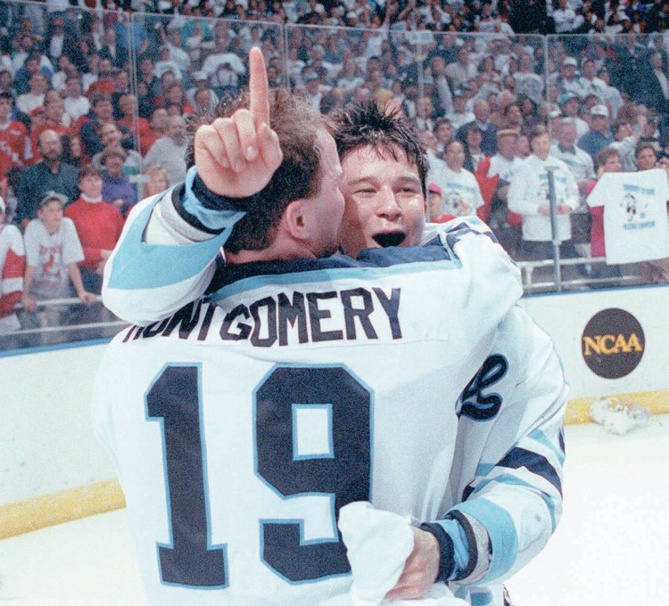 University of Maine players Jim Montgomery and Paul Kariya celebrate their team's national championship win over Michigan in 1993. 
