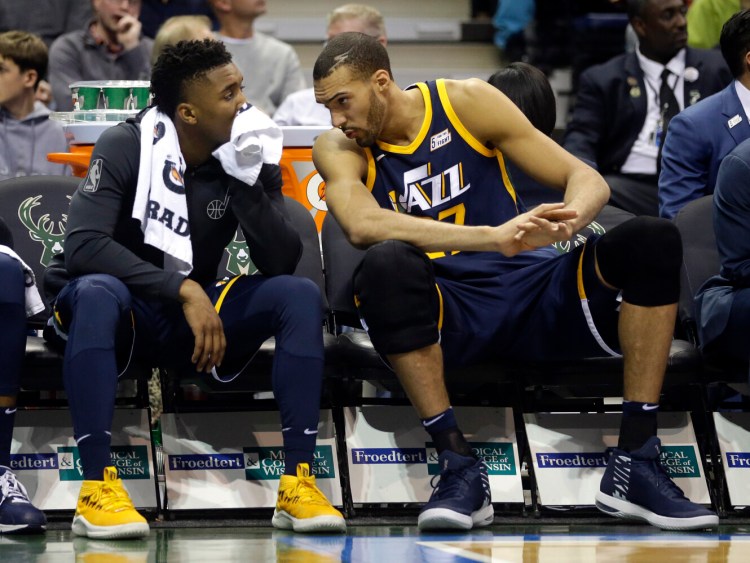 Utah Jazz center Rudy Gobert, right, was the first player to test postive for COVID-19, and teammate Donovan Mitchell, left, also tested positive. Gobert pledge more than $500,000 toward relief efforts in what he said was the first of “many steps.”