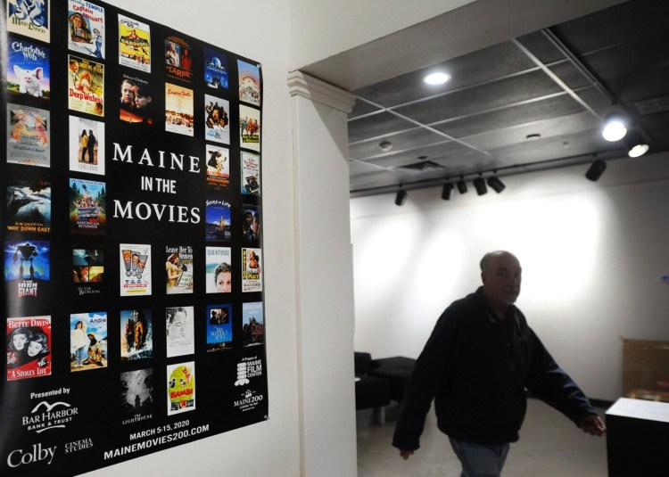 A poster announcing the upcoming Maine in the Movies event is displayed at Railroad Square Cinema in Waterville Maine Monday.