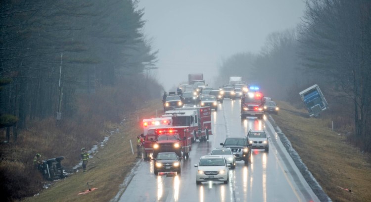 Rescue crews from Waterville, Oakland, Winslow and Delta Ambulance respond to a multi-car accident near exit 127 on Interstate 95 in Waterville on Friday.