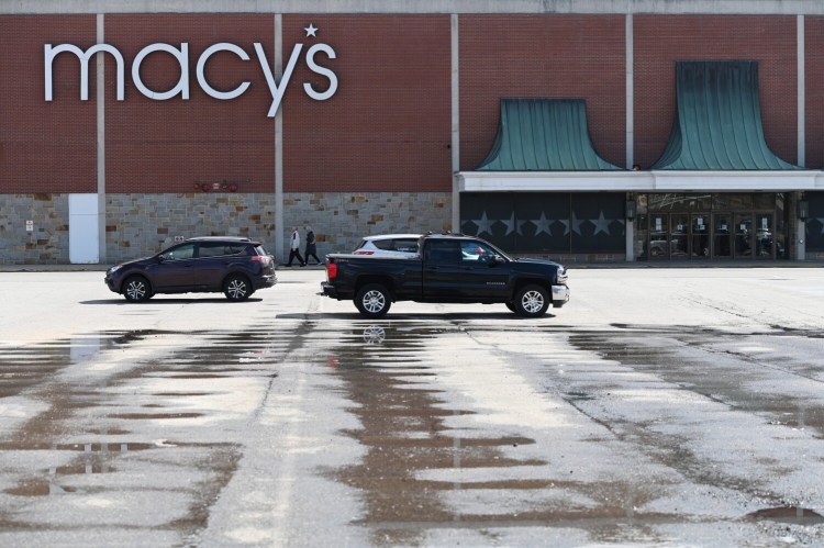 The Maine Mall parking lot is nearly empty near Macy's on Wednesday. In the wake of coronavirus, stores such as Best Buy are changing hours and policies, while others such as Macy's are closing altogether.