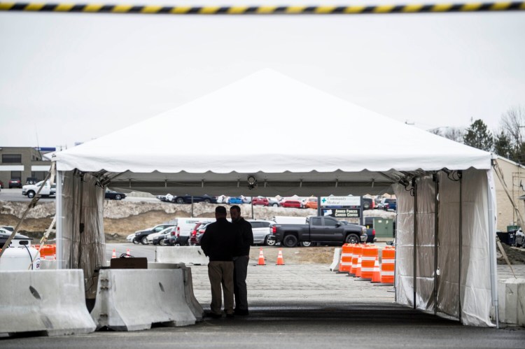 Workers from Inland Hospital prepare a drive-up coronavirus testing site Thursday in the parking lot adjacent to Faith Evangelical Free Church on Kennedy Memorial Drive in Waterville.