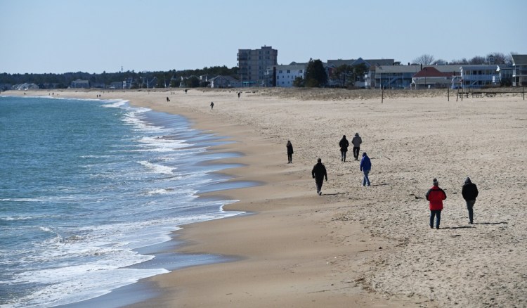 A few people got out to exercise on a nice Sunday afternoon in Old Orchard Beach. Some southern Maine beach towns saw larger crowds on Saturday that elevated fears about spreading coronavirus. 