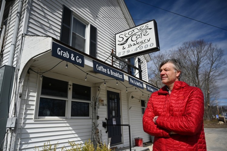 Roger Beaudoin stands outside his Stones Cafe & Bakery in North Yarmouth, a small business that he had to close, laying off his workers, due to the coronavirus pandemic, on Tuesday.
