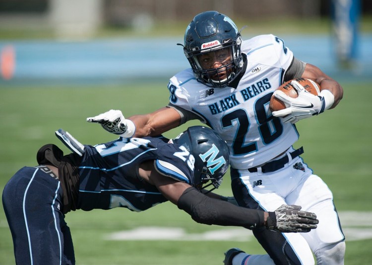 Former University of Maine running back Zaire Williams, right, is shown during an intrasquad scrimmage in Orono in May 2016. Williams was shot and killed March 2 in Philadelphia.
