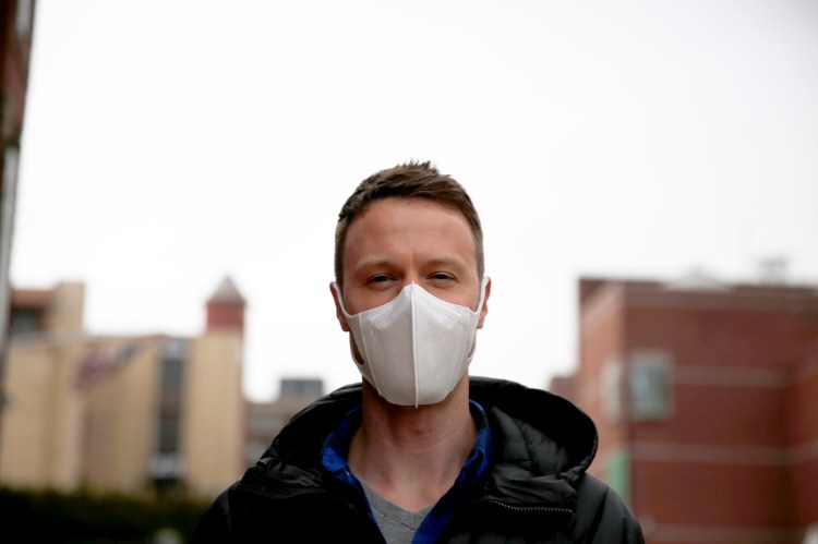 Andrew Bruns of Portland wears a protective mask on Friday. Bruns said he was wearing the mask because he traveled recently in Thailand but had no symptoms and was not sick. "I'm wearing this as a courtesy to others," he said. Health officials say masks are not the most effective means of protecting against the coronavirus and should instead be worn by those who are already infected to prevent spreading the disease to others. Frequent and proper hand washing as well as social distancing practices are the best ways to stay healthy.