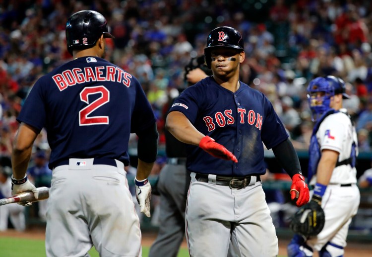Red Sox third baseman Rafael Devers, right, has developed a relationship with shortstop Xander Bogaerts. "Xander eased my transition," Devers said of his arrival in the major leagues.