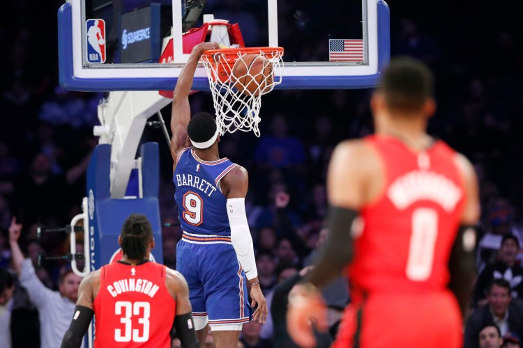 Houston's Robert Covington and Russell Westbrook watch as New York Knicks guard RJ Barrett during the Knicks' 125-123 win Monday in New York. 