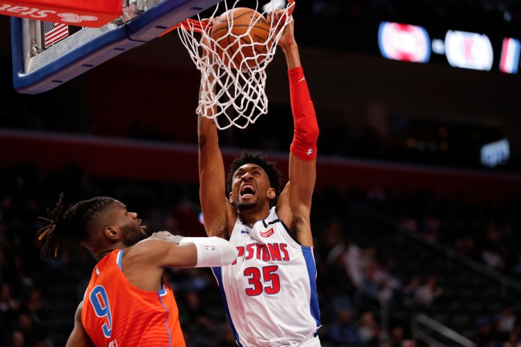 Detroit Pistons forward Christian Wood, right, is tested positive for the coronavirus, according to a source. Wood would be the third NBA player, after Rudy Gobert and Donovan MItchell, to test positive for the virus.