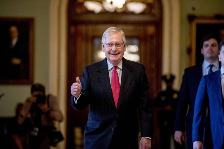Senate Majority Leader Mitch McConnell of Kentucky gives a thumbs up as he leaves the Senate chamber on Capitol Hill in Washington, on Wednesday, where a deal was  reached on a coronavirus bill. 