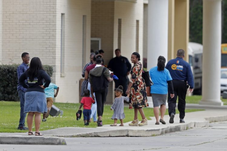 Congregants arrive at the Life Tabernacle Church in Central, La., on Sunday.