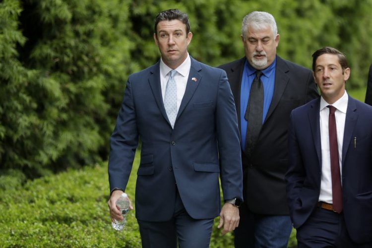 Convicted ex-Rep. Duncan Hunter, left, served six terms representing one of Southern California's last solidly Republican districts before he resigned. The former congressman will serve almost a year in prison.