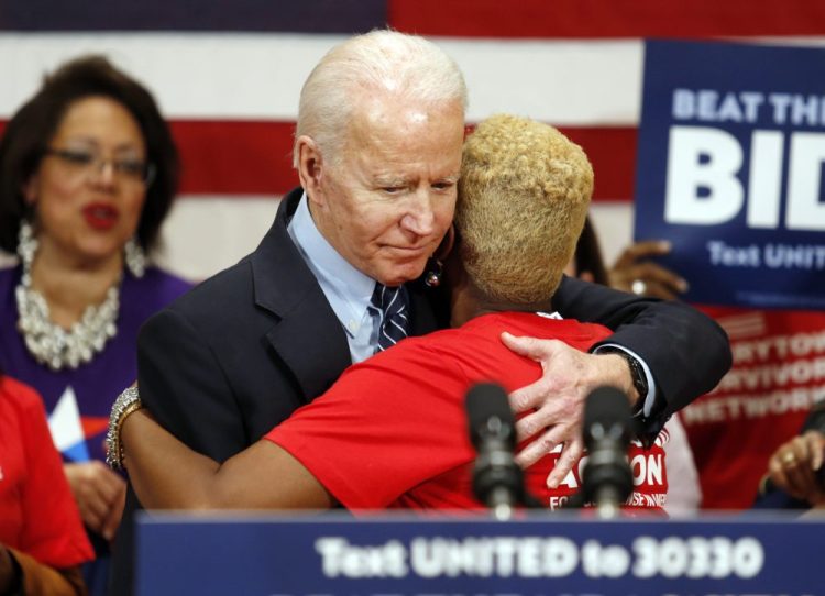 Democratic presidential candidate former Vice President Joe Biden hugs Crystal Turner of Columbus, Ohio, with Moms Demand Action during a campaign rally in Columbus, Ohio, on Tuesday. Both Biden and fellow Democratic presidential candidate Sen. Bernie Sanders abruptly canceled election-night rallies Tuesday night in Cleveland amid concerns over the spread of the new coronavirus – as public health fears began transforming the 2020 race.