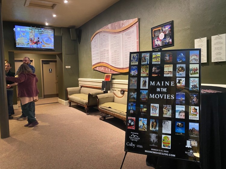 A Maine in the Movies promotional poster is displayed Thursday outside the theater at the Waterville Opera House.