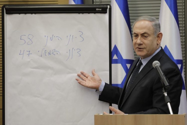 Israeli Prime Minister Benjamin Netanyahu explains some elections results Wednesday during a meeting with his nationalist allies and his Likud party members at the Knesset, Israeli Parliament, in Jerusalem.