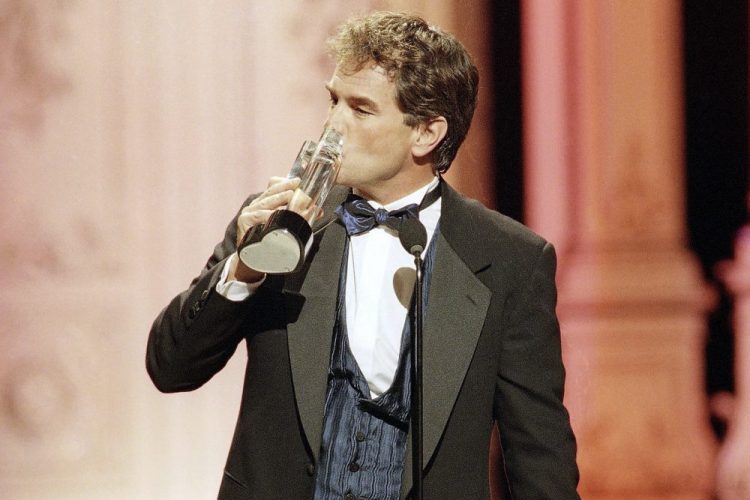 John Callahan of "All My Children" kisses his award in 1998 after winning Outstanding Lead Actor at the Soap Opera Digest Awards in Universal City, Calif. 