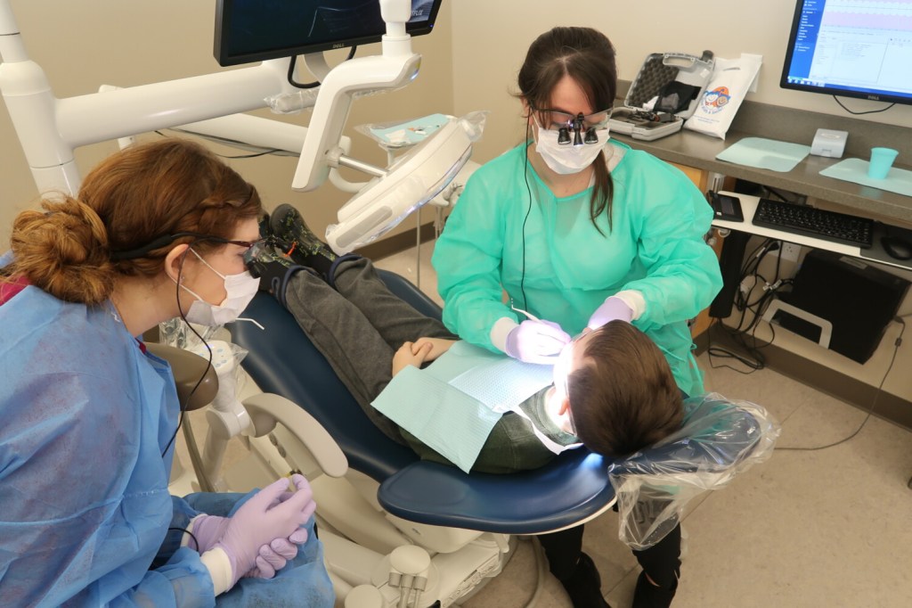 UNE College of Dental Medicine students provide free care to children