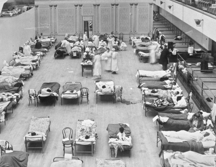Volunteer nurses from the American Red Cross tend to influenza patients in 1918 in the Oakland Municipal Auditorium, used as a temporary hospital. Woodrow Wilson did not address the nation on the subject of the pandemic of 1918-19 a single time, he did not call for Congress to act and he did not summon the nation to come together.