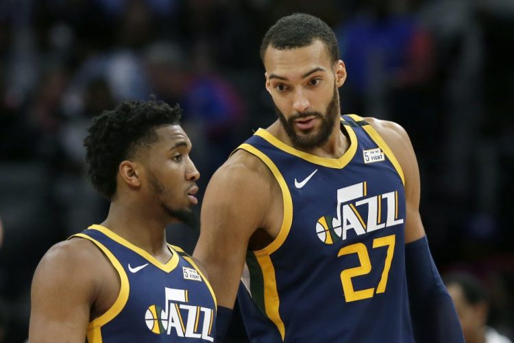 Utah's Rudy Gobert , right, and Donovan Mitchell have tested positive for the coronavirus.  Gobert's test result forced the NBA to suspend the season. 