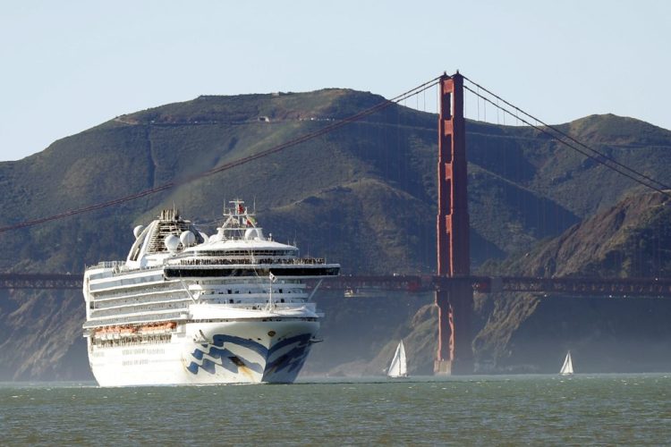 The Grand Princess cruise ship passes the Golden Gate Bridge Feb. 11 as it arrives from Hawaii in San Francisco. Scrambling to keep the coronavirus at bay, officials ordered the cruise ship to hold off the California coast Thursday to await testing of those aboard, after a passenger on an earlier voyage died and at least four others became infected.