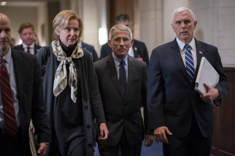 Dr. Deborah Birx, left, the coronavirus response coordinator, and Dr. Anthony Fauci, center, director of the National Institute of Allergy and Infectious Diseases, walk with Vice President Mike Pence, right, on Capitol Hill in Washington on Wednesday. Congress on Thursday sent to President Trump an $8.3 billion bill to fund the government's response to the public health emergency. 
