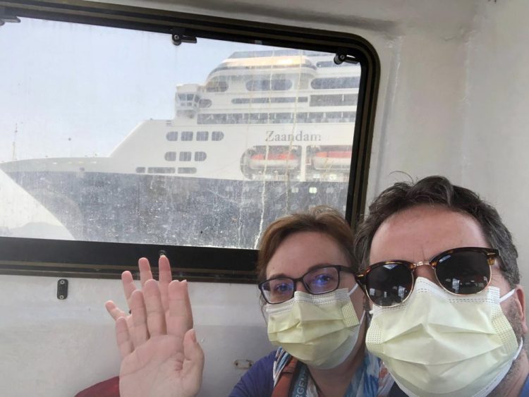 Laura Gabaroni and her husband, Juan Huergo, take a selfie on Saturday on board a tender after they were evacuated from the Zaandam, a Holland American cruise ship, near the Panama Canal. The Orlando-area couple was transferred to the Rotterdam, together with others who were deemed healthy. Four people have died on board the Zaandam and many others have are suffering from flu-like symptoms. 
