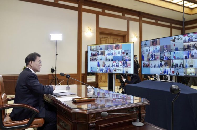 South Korean President Moon Jae-in attends an emergency G-20 virtual summit Thursday to discuss the coronavirus outbreak at the presidential Blue House in Seoul, South Korea.