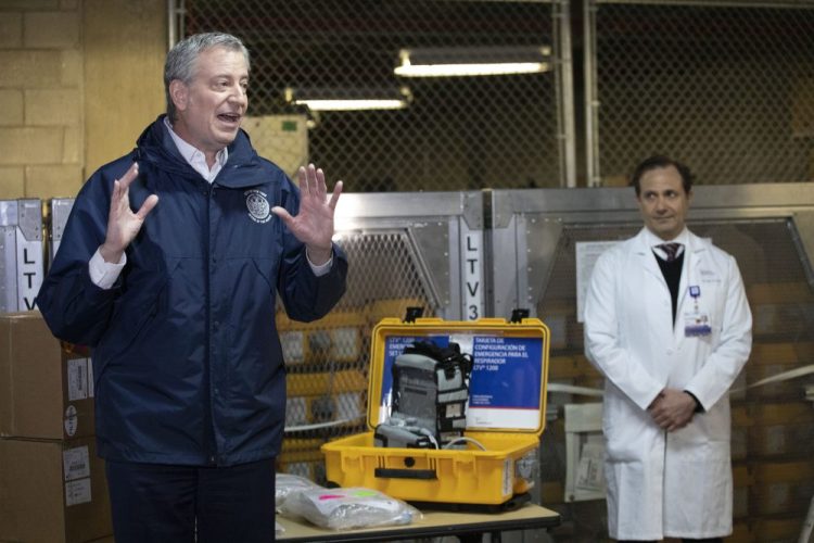 New York City Mayor Bill de Blasio discusses the arrival of a shipment of 400 ventilators along with Dr. Steven Pulitzer, chief medical officer of NYC Health and Hospitals, at the city's Emergency Management Warehouse on Tuesday.