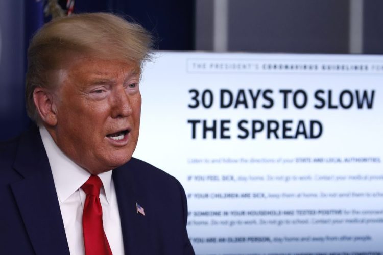 President Trump speaks about the coronavirus Tuesday at the White House. He said, "I want every American to be prepared for the hard days that lie ahead."