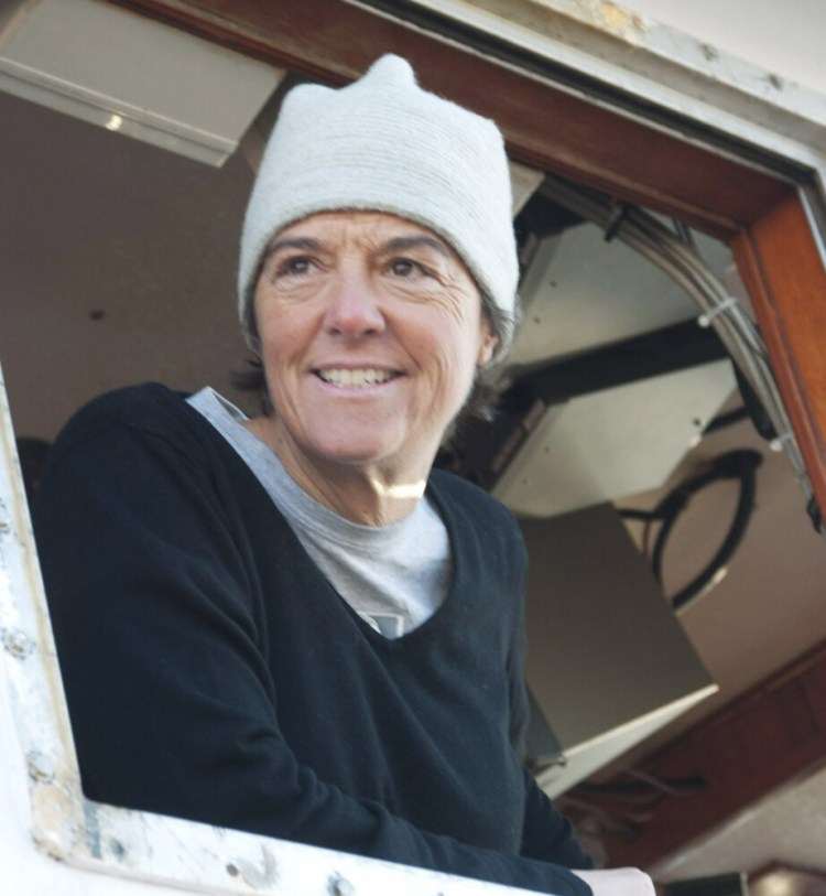 Capt. Linda Greenlaw, of the f/v Hannah Boden, looks out from the vessel window at the Portland Fish Exchange in November 2010.