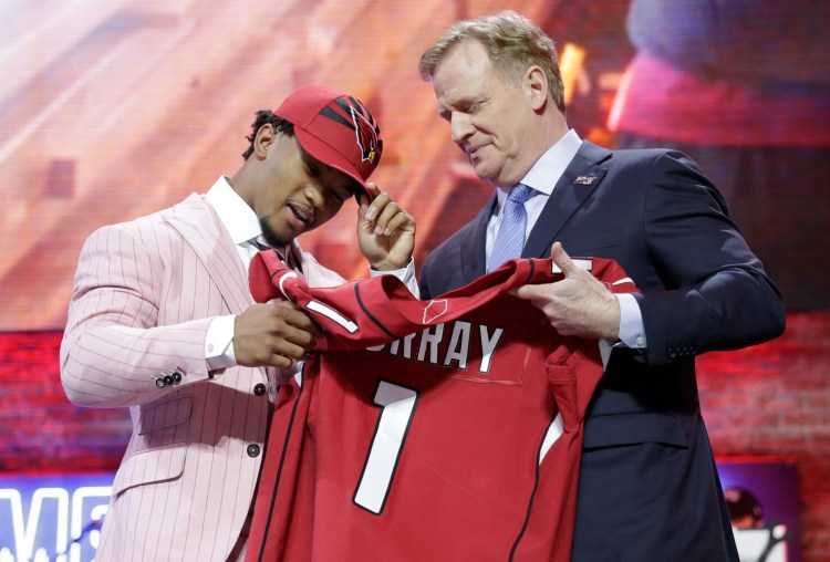 Kyler Murray, the No. 1 pick in the 2019 NFL draft, is handed a jersey by NFL Commissioner Roger Goodell. The No. 1 pick in the 2020 draft will not get a moment with the commissioner because the draft will be completely virtual due to the coronavirus pandemic.