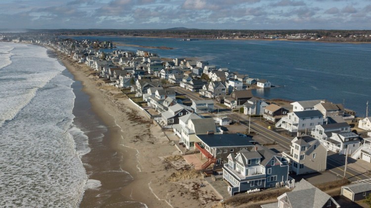 Aerial view of houses along Wells Beach, photographed on Saturday. Town officials are discouraging out of state seasonal residents from coming to their homes and also from allowing short-term rentals of the homes. Gov. Janet Mills has ordered that anyone arriving from out of state must self-quarantine for 14 days.