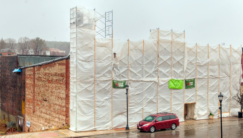 The facade of the Colonial Theater shrouded in plastic covered scaffolding, seen Friday in downtown Augusta.