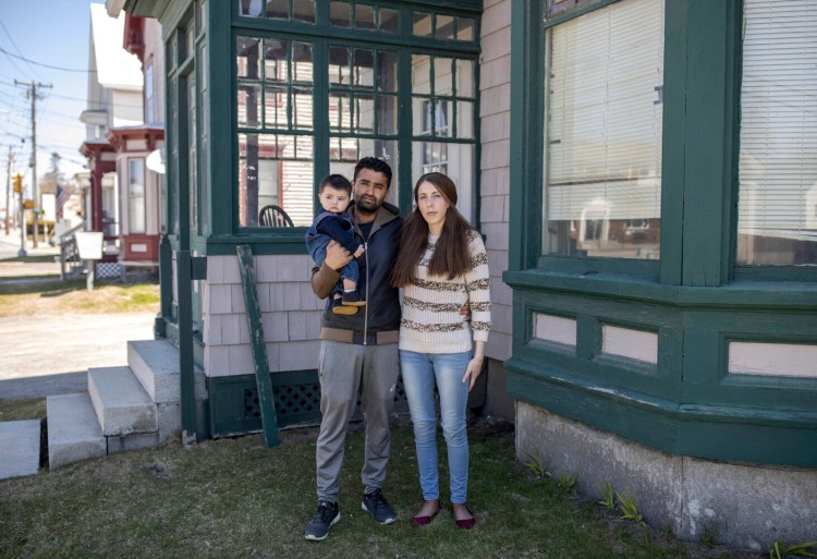 WATERVILLE, ME - APRIL 25: Alexandra Goards poses for a photo with her husband, Ashish and their son, Lucca, in Waterville on Saturday, April 25, 2020. Her husband legal  immigrant to the United States and does not have a valid social security number. Since they file their taxes jointly, neither Goards nor their baby can get any stimulus money. (Staff photo by Brianna Soukup/Staff Photographer)