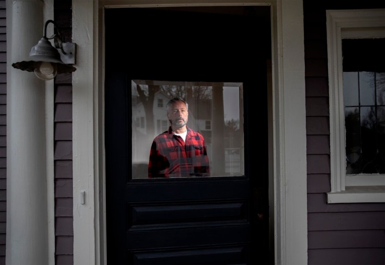James Salomon, an architectural photographer seen at his home in Portland, lost most of his work shortly after the coronavirus pandemic hit. He's angry about the delayed rollout of benefits for self-employed workers.