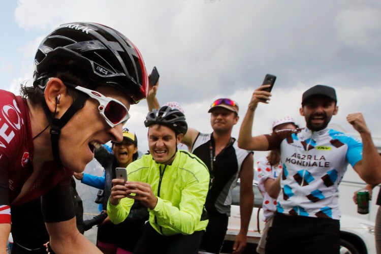 Spectators cheer Britain's Geraint Thomas during the 2019 Tour de France. The event was postponed on Tuesday, with hopes that it can still be held this year. 