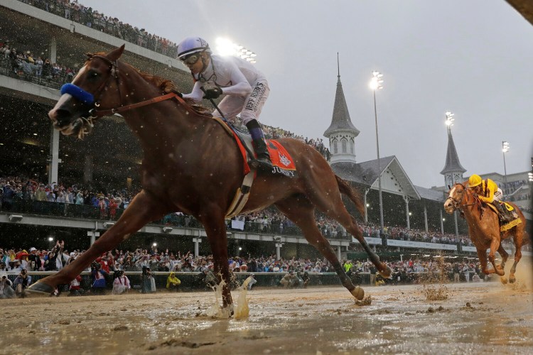 Mike Smith rides Justify to victory during the 144th running of the Kentucky Derby inon May 5, 2018 at Churchill Downs in Louisville, Ky. The move of the Triple Crown’s first leg to Labor Day weekend due to the coronavirus pandemic will mark the first time the Derby won’t run on the first Saturday in May since 1945. 