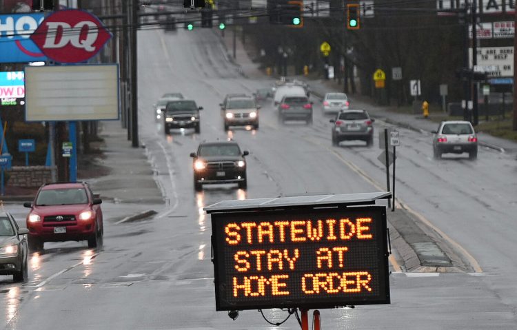 A sign in Saco on April 2 advises of the statewide stay-at-home order.