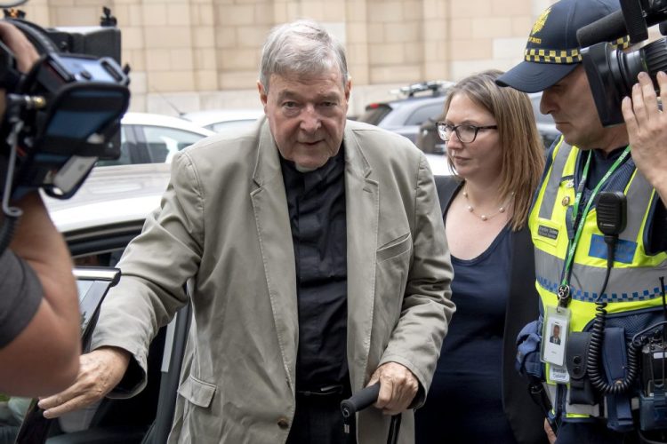 Cardinal George Pell leaves the County Court in Melbourne, Australia on Feb. 26, 2019. Australia's highest court overturned the convictions of Pell, the most senior Catholic convicted of child sex abuse. The 78-year-old Pell is one year into a six-year sentence for molesting two 13-year-old choirboys in Melbourne’s St. Patrick’s Cathedral while he was the city’s archbishop in the late 1990s.