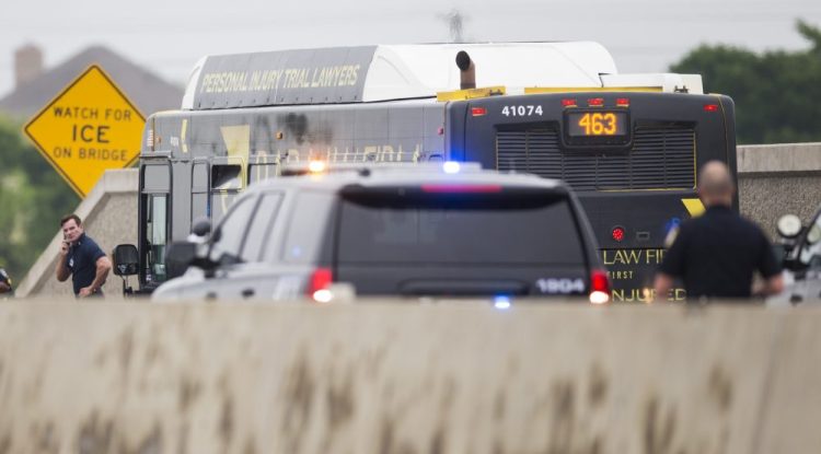 A DART bus is investigated after a gunman held the driver hostage and fired shots inside the bus while being chased by police on Sunday in Garland, Texas. The gunman was shot by officers and transported to the hospital, where he was pronounced dead. Two officers were shot and transported to the hospital with non-life threading injuries.