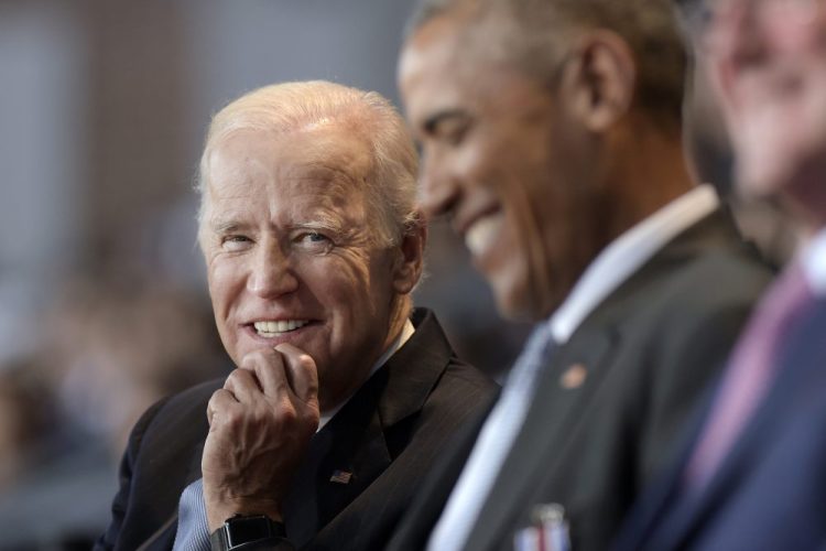 Vice President Joe Biden, left, watches President Barack Obama during a 2017 appearance.
