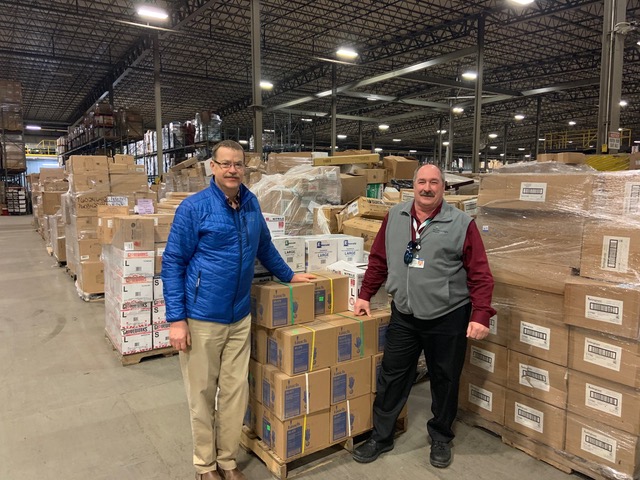 John Marden, left, with
Joe Theriault, director of the regional supply chain for Northern Light Inland Hospital, with the recent delivery to Good Shepherd Food Bank.