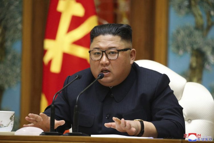 North Korean leader Kim Jong Un attends a politburo meeting of the ruling Workers' Party of Korea on April 11 in Pyongyang. The South Korean government is looking into reports that Kim is in fragile condition after surgery.
