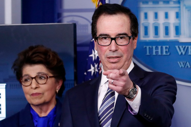Jovita Carranza, administrator of the Small Business Administration stands next to Treasury Secretary Steven Mnuchin at the White House on April 2.

