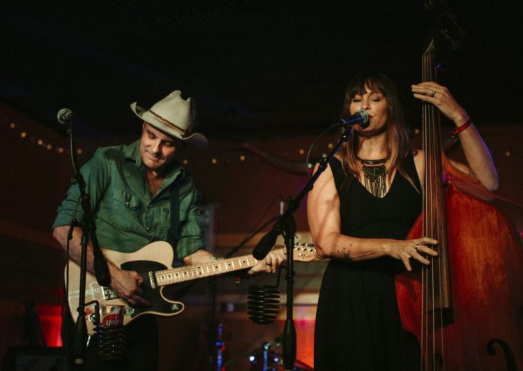 In this September 2019 photo, Doug and Telisha Williams, married musicians who perform together as the Wild Ponies, perform at Dee’s Country Cocktail Lounge in Nashville, Tenn. 